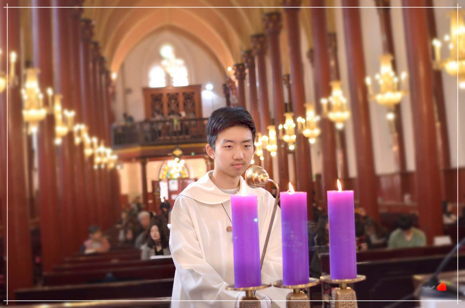 Image of me lighting a candle at church